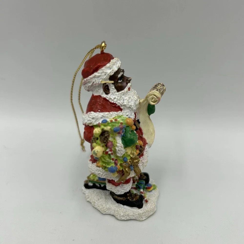 The International‎ Santa Claus Collection 1997 African American Santa Flawed